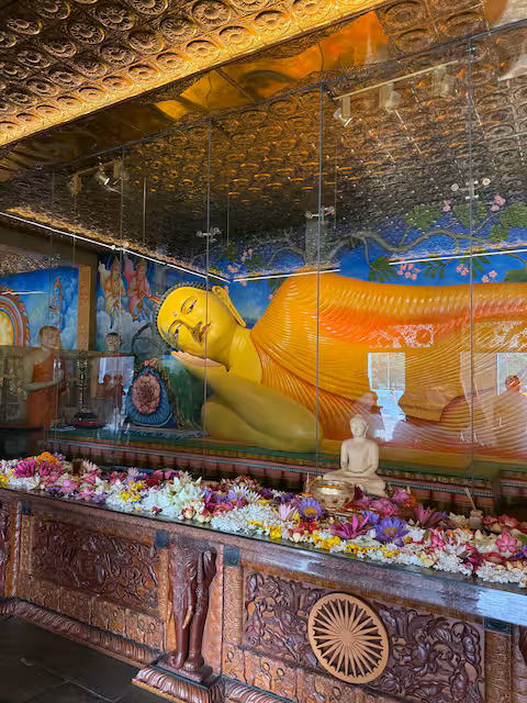 Reclining Buddha within a painted temple