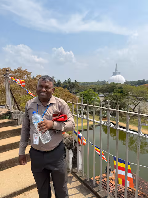 Gunarathna smiling on a bridge during an Anuradhapura tour