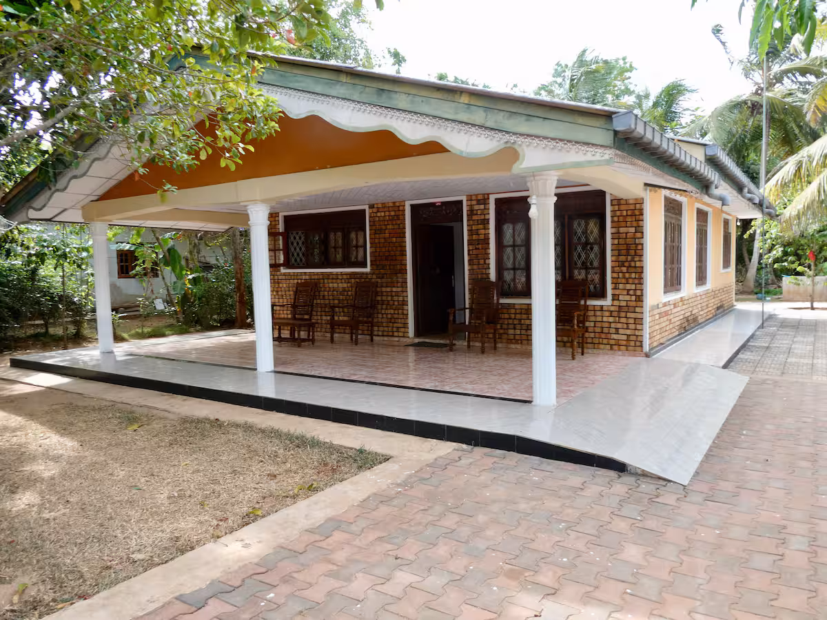 Green Village guesthouse beneath tropical trees